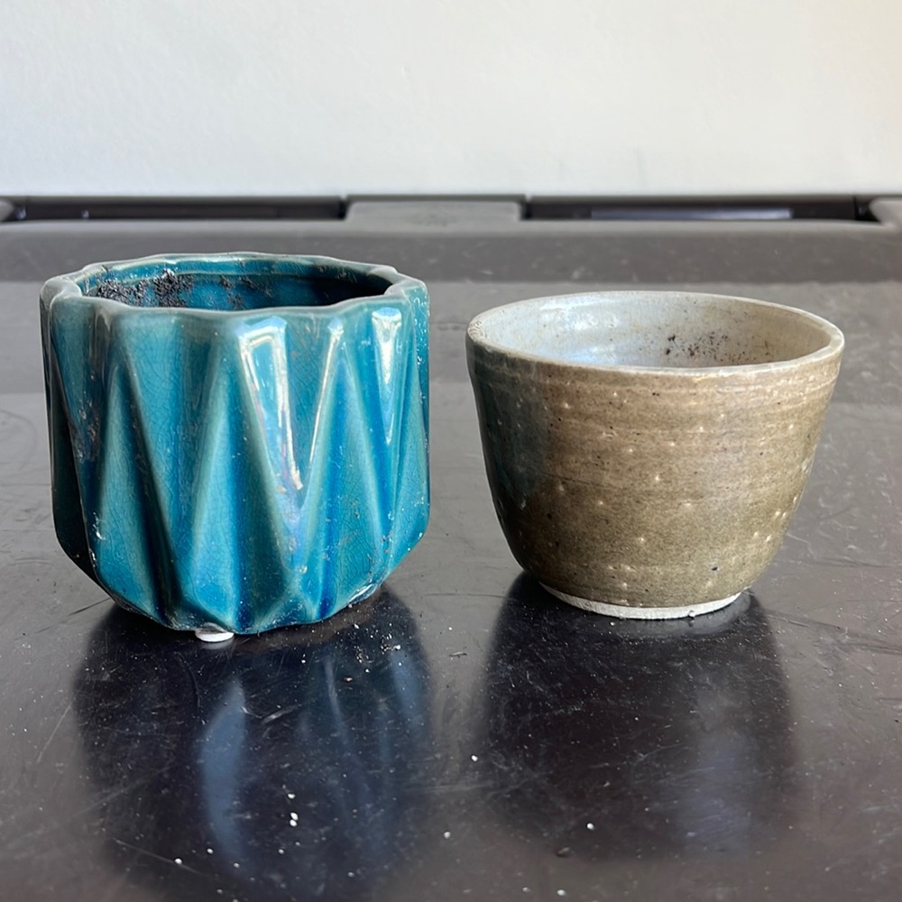 Two approximately 3 inch ceramic decorative planters